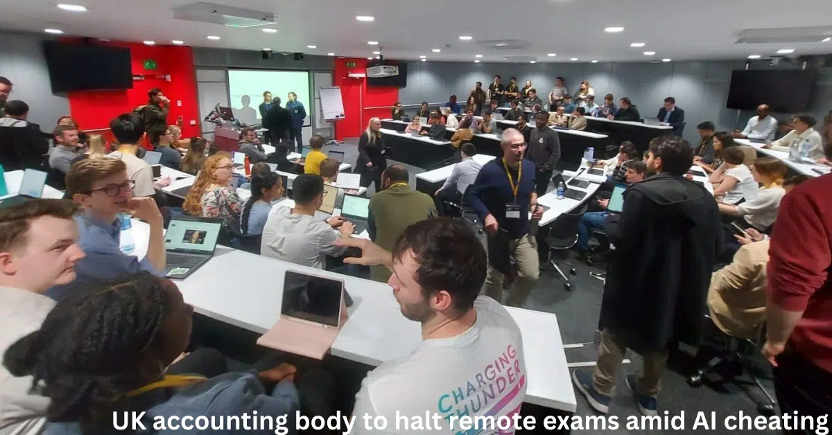 Crowded UK university lecture hall with students using laptops during an in-person exam or academic session amid concerns over AI cheating.